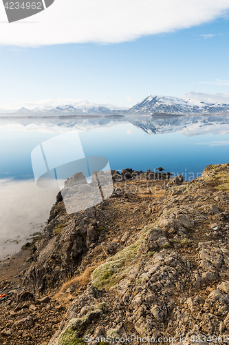 Image of Icelandic mountains with the amazing lagoon in winter