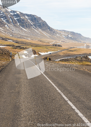 Image of Asphalt road among mountains in Iceland