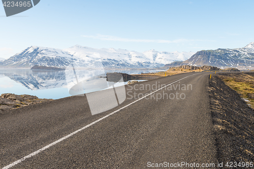 Image of Asphalt road among mountains in Iceland