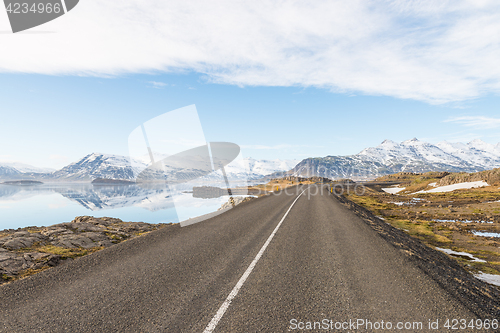 Image of Asphalt road among mountains in Iceland