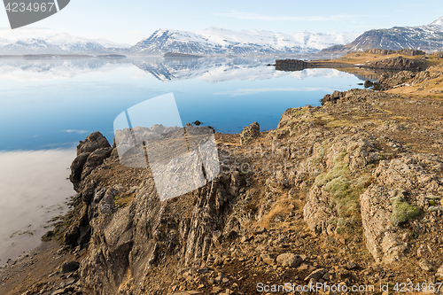 Image of Icelandic mountains with the amazing lagoon in winter