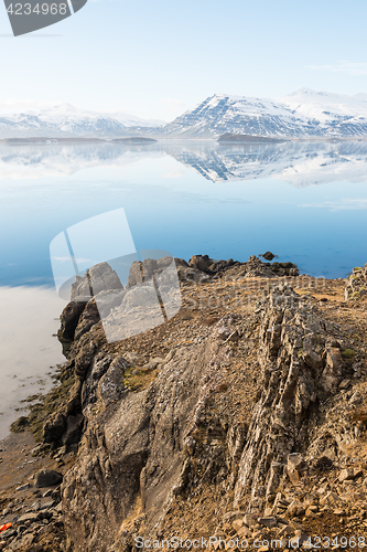 Image of Icelandic mountains with the amazing lagoon in winter