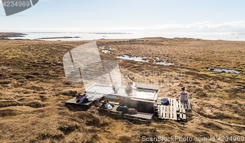 Image of Icelandic hotpot among the amazing lagoon and mountains