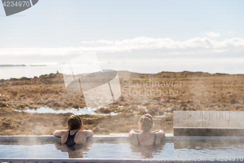 Image of Icelandic hotpot among the amazing lagoon and mountains