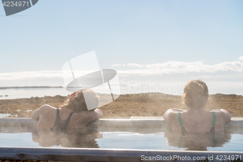 Image of Icelandic hotpot among the amazing lagoon and mountains