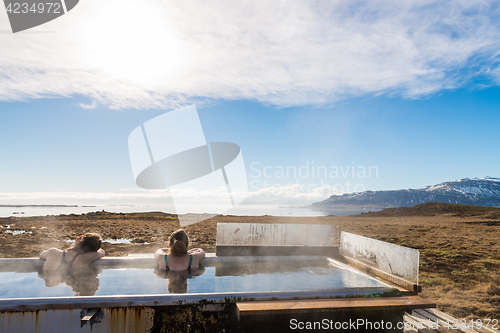 Image of Icelandic hotpot among the amazing lagoon and mountains