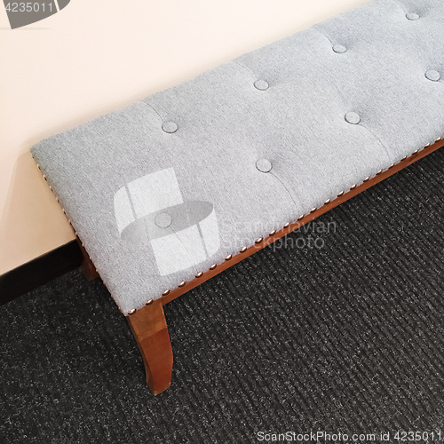 Image of Gray elegant bench on carpet floor