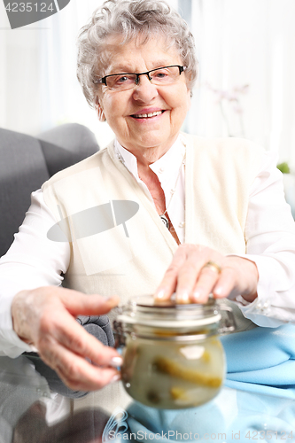 Image of Grandma&#39;s preserves, delicious place the jars for the winter Grandma&#39;s pantry, cucumbers in a jar