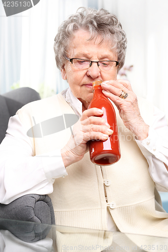 Image of Grandma&#39;s preserves, puree with red tomatoes.