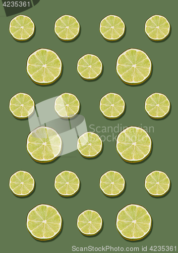 Image of The lemon pattern on green background. Minimal concept.