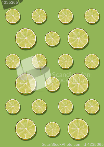 Image of The lemon pattern on green background. Minimal concept.