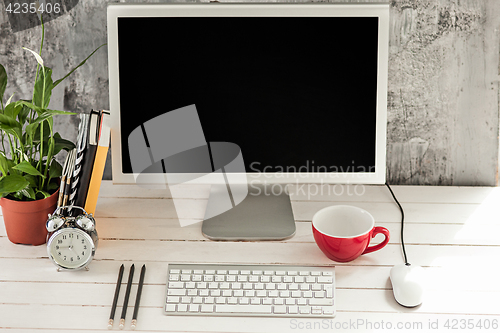 Image of Stylish workspace with computer at home or studio