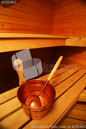 Image of Interior of sauna, bucket and scoop