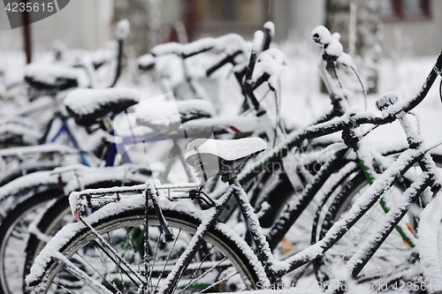 Image of bikes covered with a blanket of snow