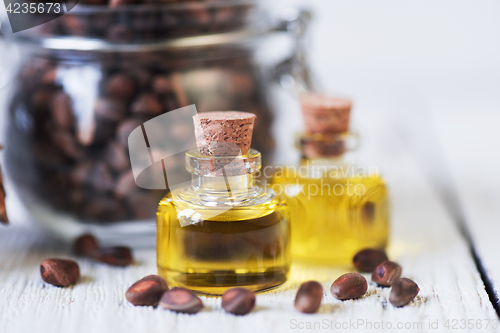 Image of The cedar oil in a glass bottle