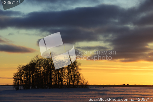 Image of sunset on the lake in winter, Finland