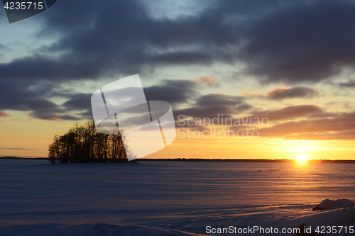 Image of sunset on the lake in winter, Finland