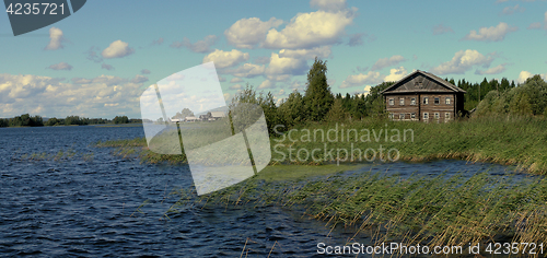 Image of traditional wooden house on the shore of Lake Onega, Russia