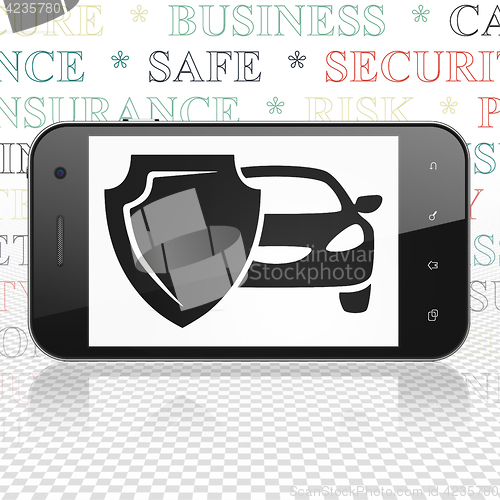 Image of Insurance concept: Smartphone with Car And Shield on display