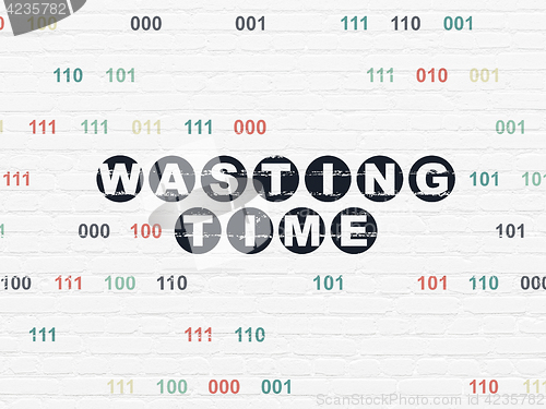 Image of Time concept: Wasting Time on wall background