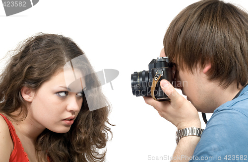 Image of Photographer taking pictures of the young woman. isolated 4