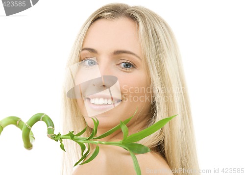 Image of happy blonde with bamboo