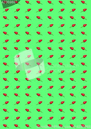 Image of bitter chili pepper and paprika on a green background