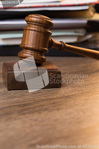 Image of Image of hammer against documents