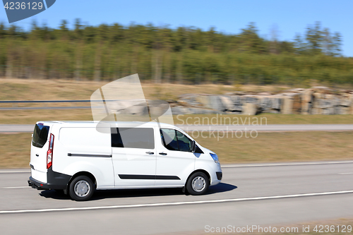 Image of White Delivery Van at Speed