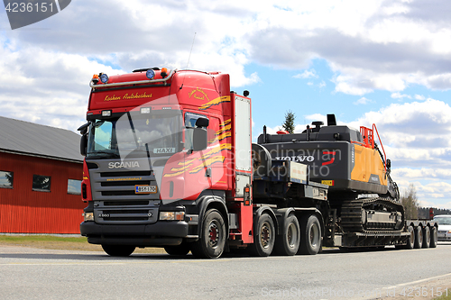 Image of Red Scania Semi Trailer Hauls Hydraulic Excavator