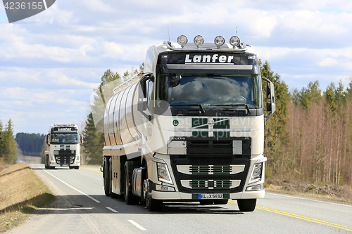 Image of Two Volvo FH Semi Tank Trucks Convoy along Road