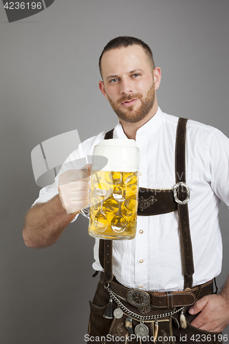Image of young bavarian with a beer