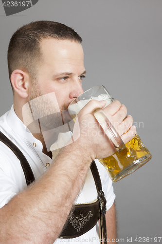 Image of young bavarian with a beer