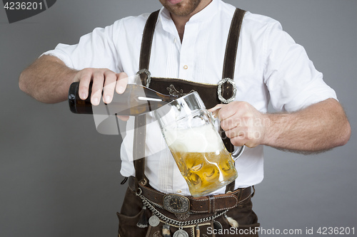 Image of young bavarian with a beer