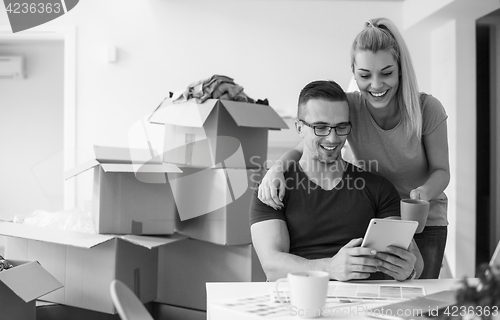 Image of Young couple moving in a new home