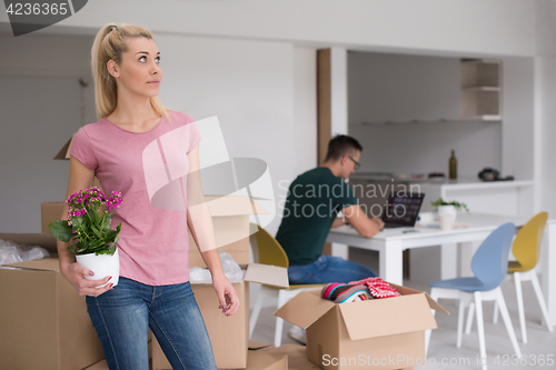 Image of young couple moving into a new home