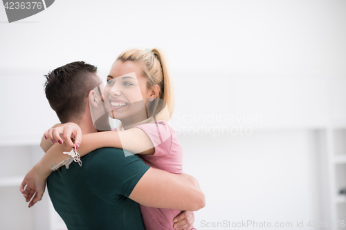 Image of happy Young couple moving in new house