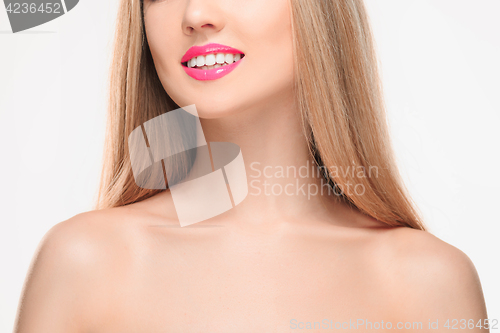 Image of The sensual red lips, mouth open, white teeth.