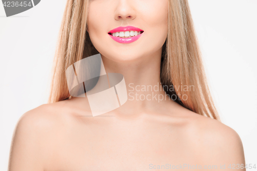 Image of The sensual red lips, mouth open, white teeth.