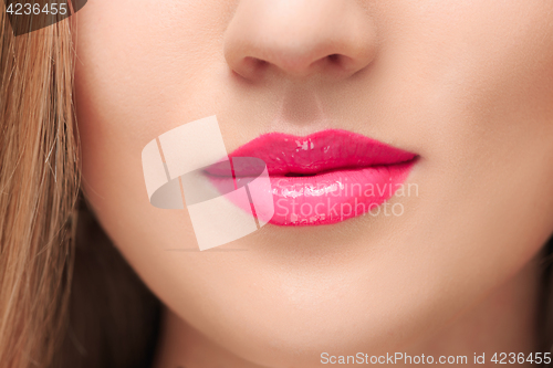 Image of The sensual red lips close up