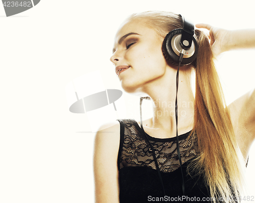 Image of young sweet talented teenage girl in headphones singing isolated