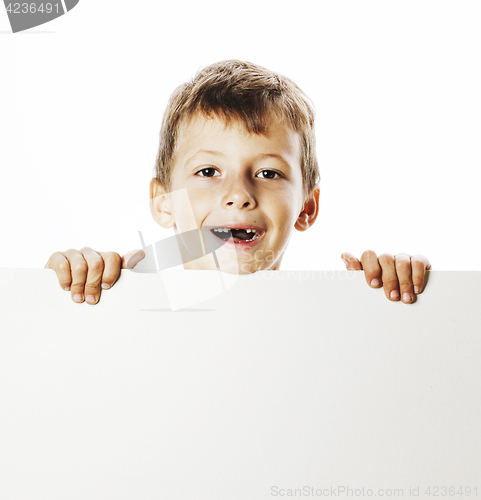 Image of little cute boy holding empty shit to copyspace isolated close u