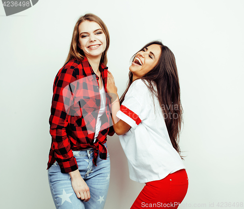 Image of best friends teenage girls together having fun, posing emotional on white background, besties happy smiling, lifestyle people concept, blond and brunette multi nations