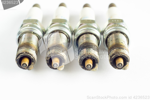 Image of Set of damaged spark plugs