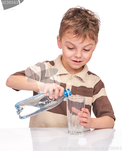 Image of Little boy with plastic bottle of water