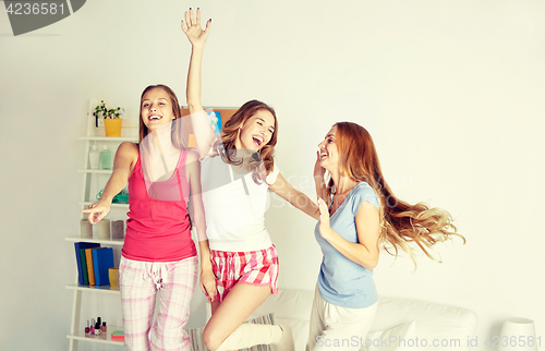 Image of happy friends or teen girls having fun at home