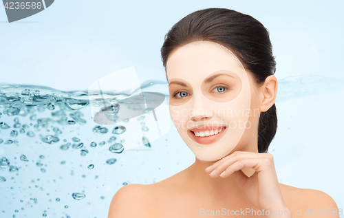 Image of beautiful young woman with collagen facial mask