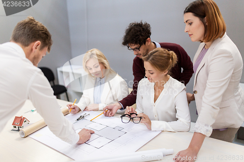 Image of business team discussing house project at office