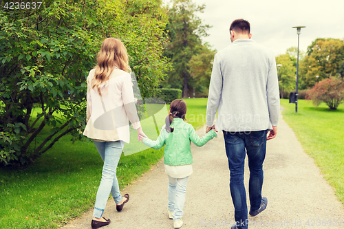 Image of happy family walking in summer park