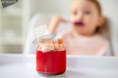 Image of jar of baby food on table at home